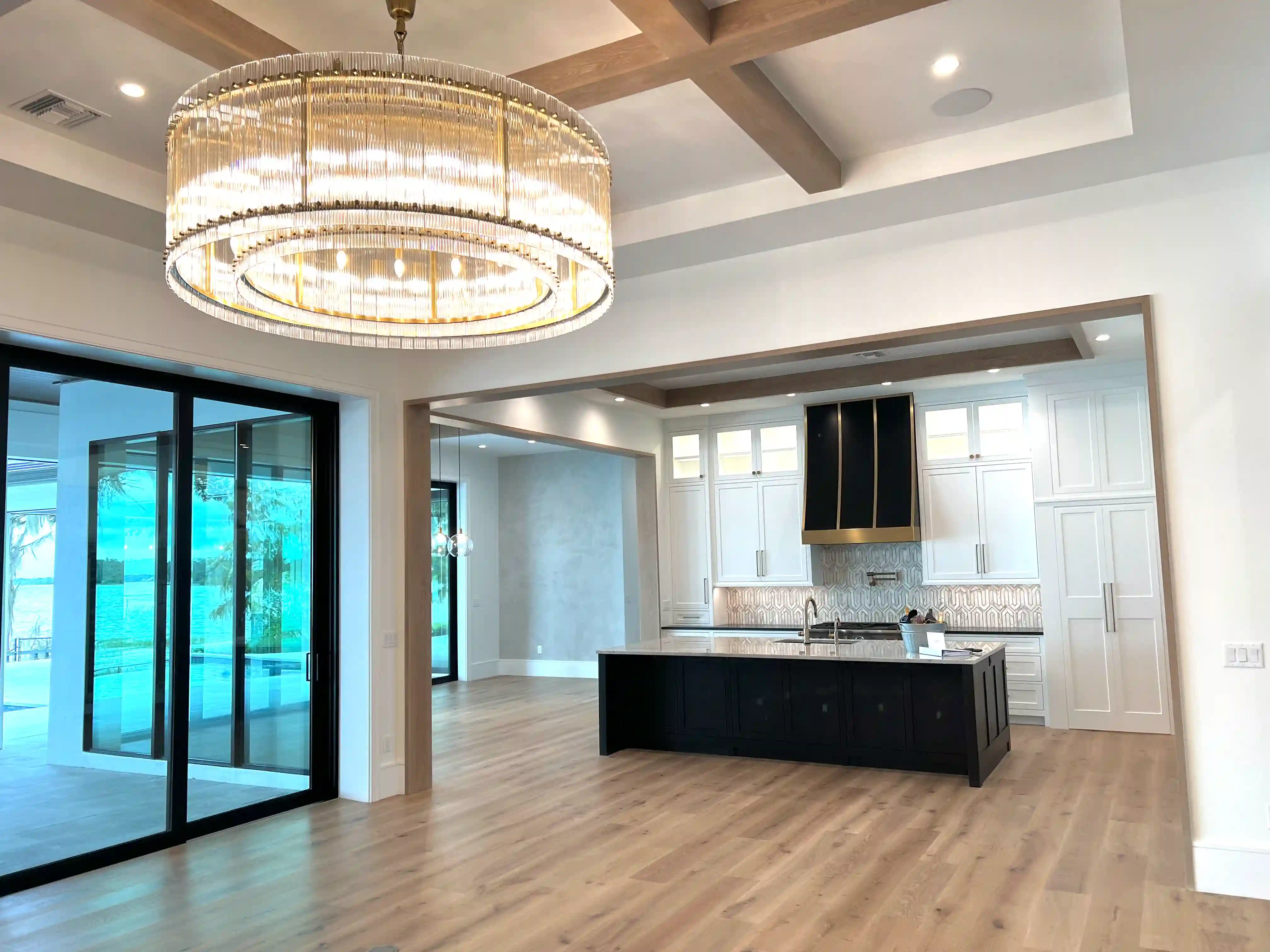 Kitchen wide chandelier lake view finished