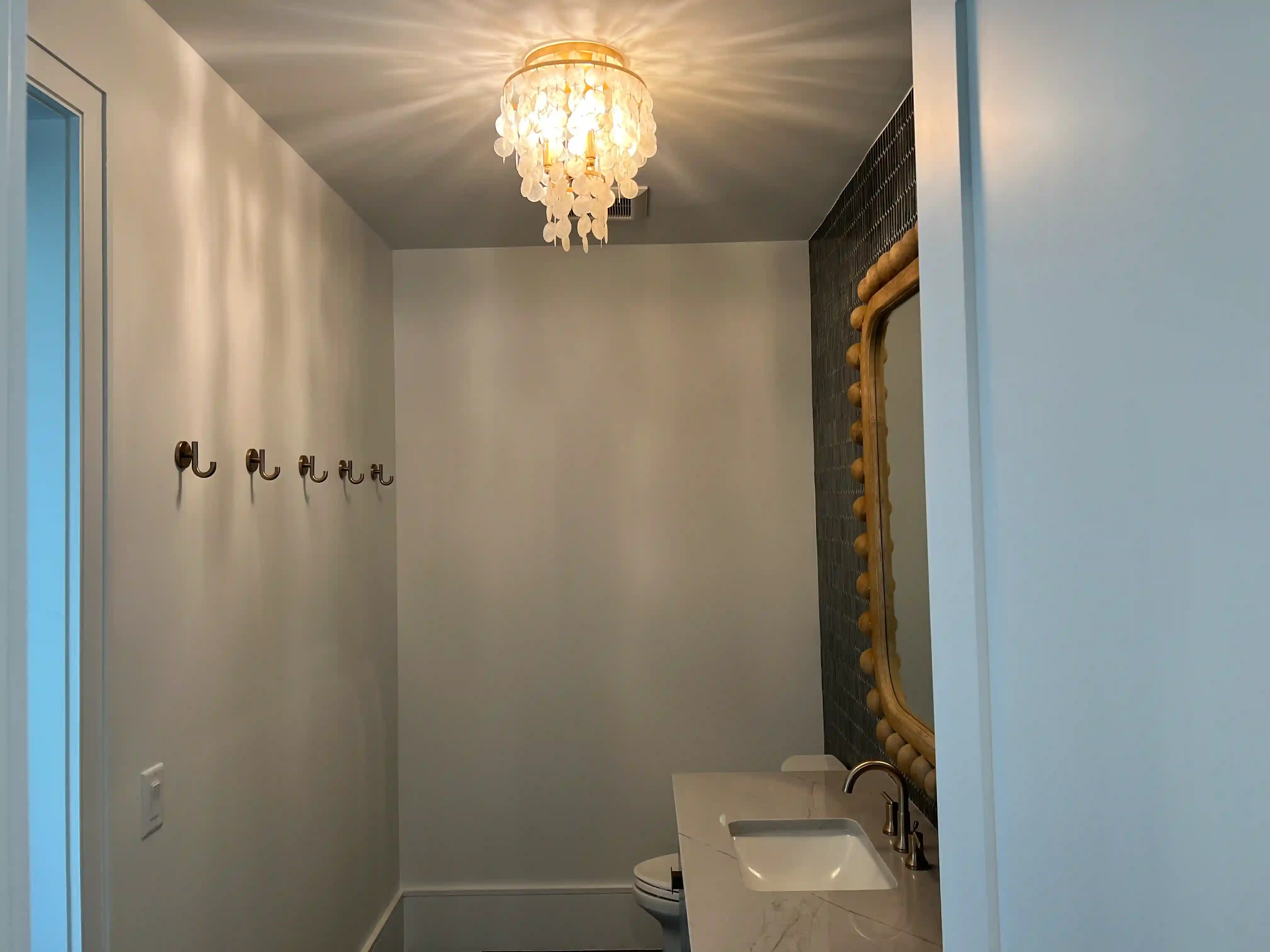 Powder room shell chandelier finished